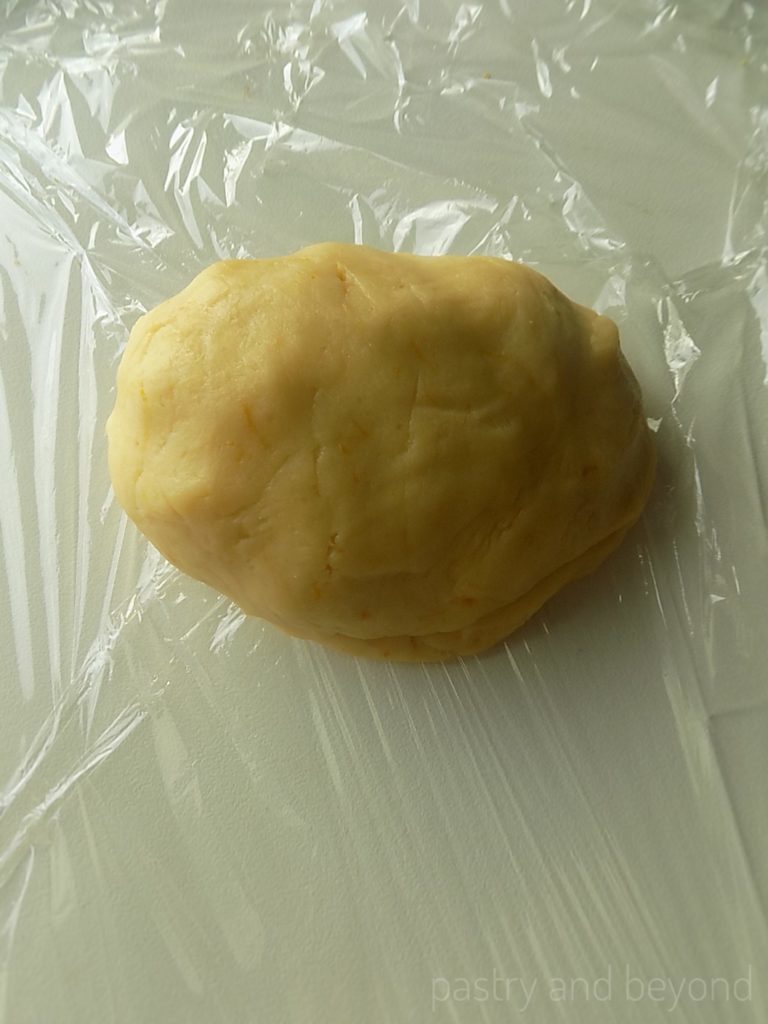 Lemon cookie dough on a plastic film.