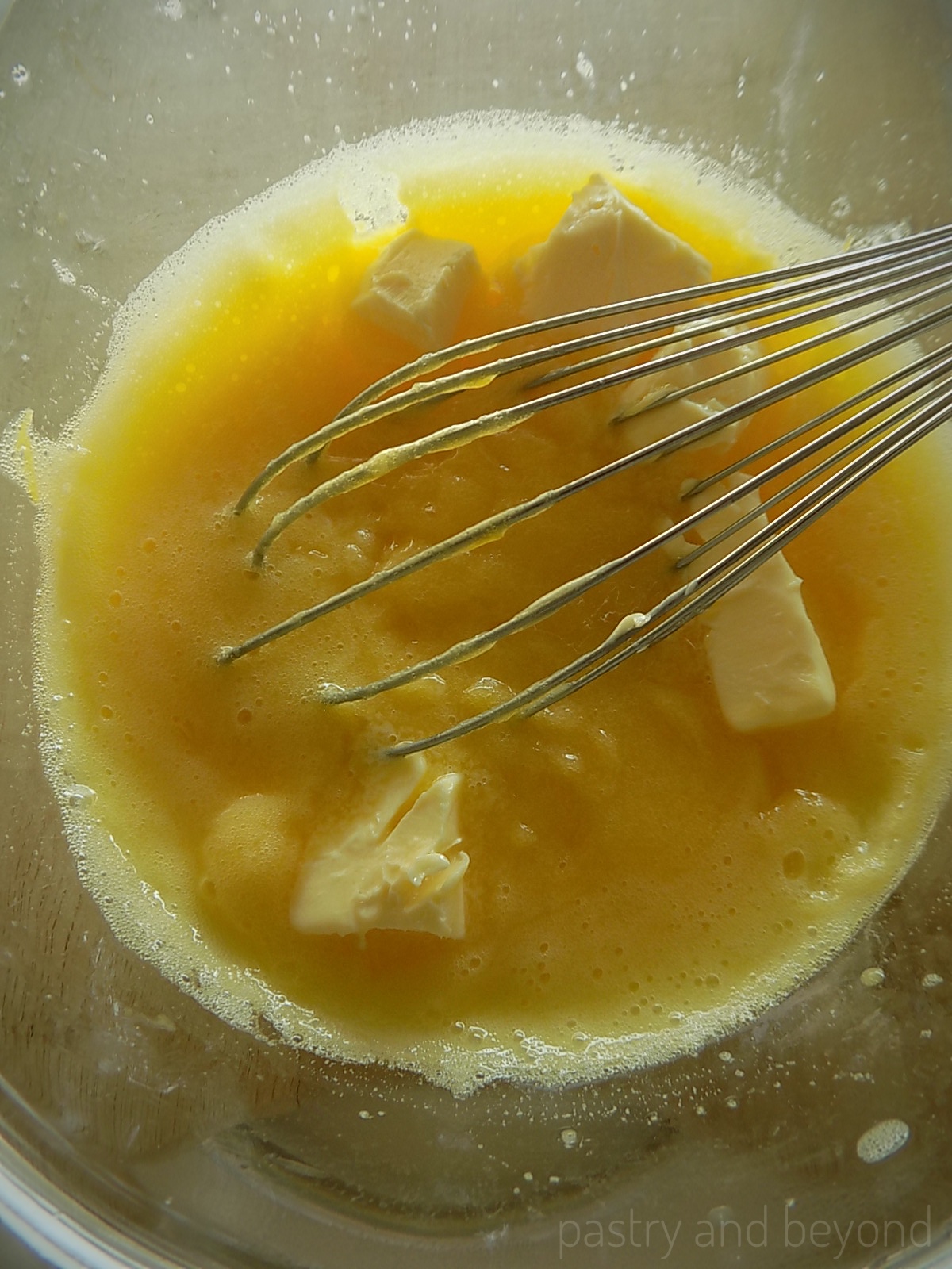 Cubed butter added into the mixture and mixed with a whisk.