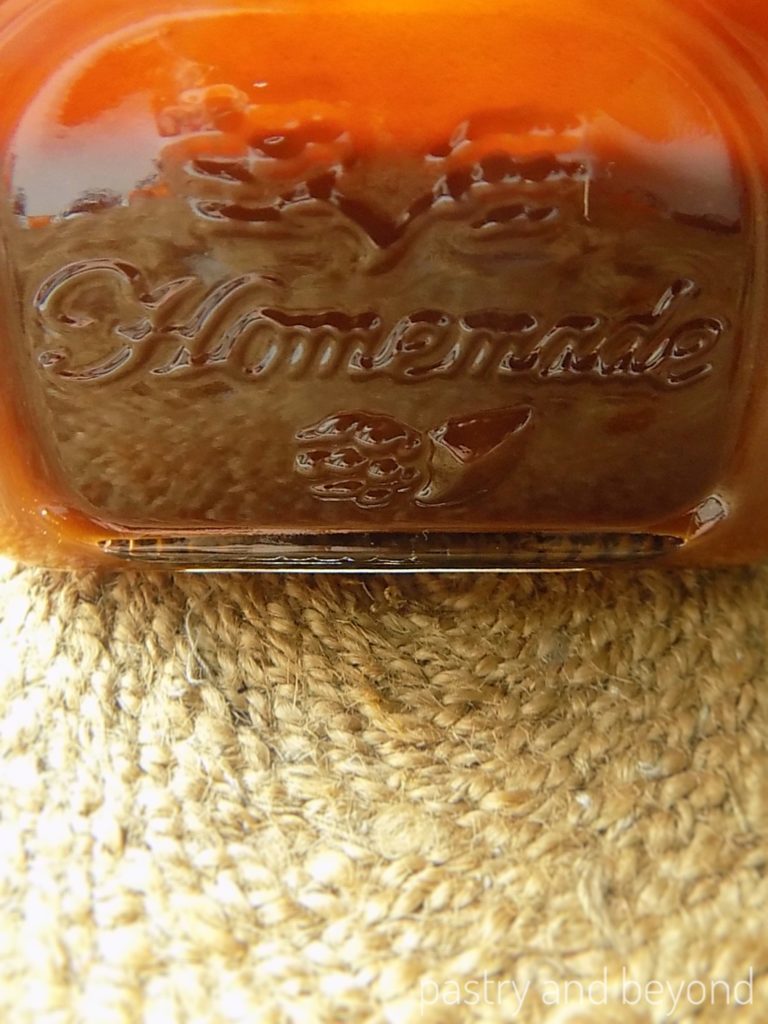 Homemade caramel sauce in a jar.