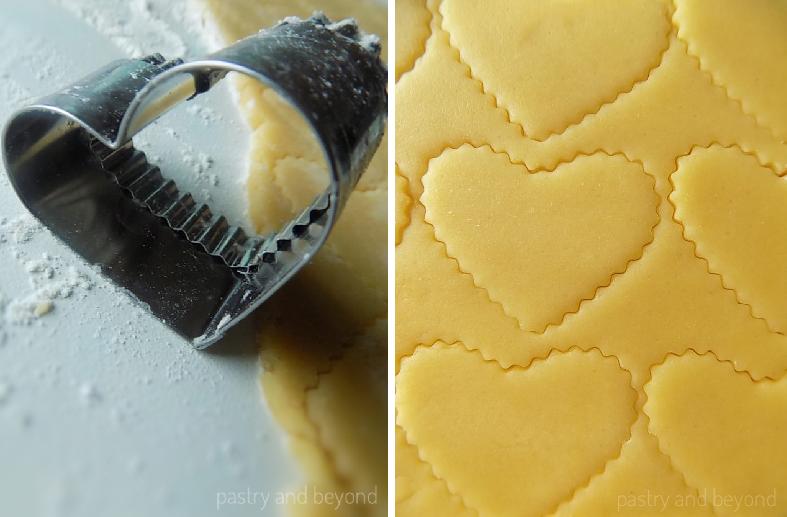 Cutting out the rolled out dough with a heart shaped cookie cutter.