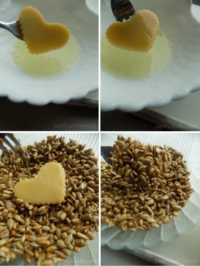 Covering the heart cut cookie dough with egg white and sunflower seeds.