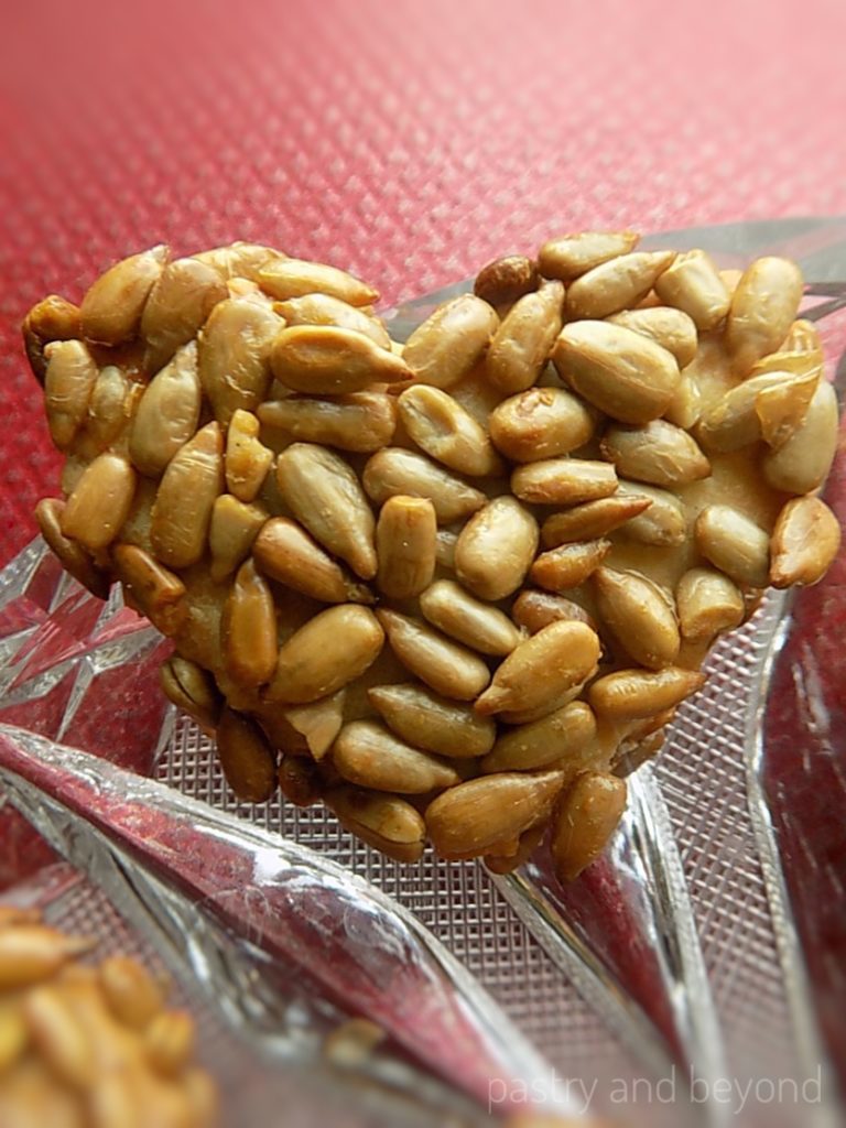 Sunflower seed cookie on a glass plate.
