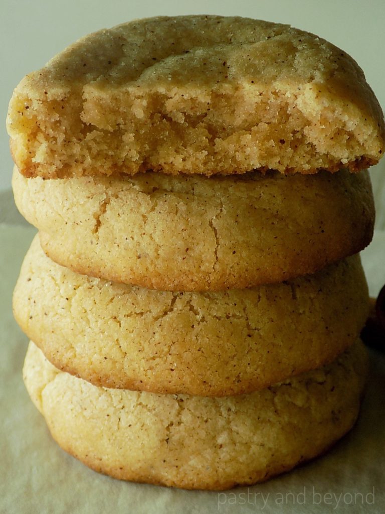 Stacked thick and soft cinnamon cookies.