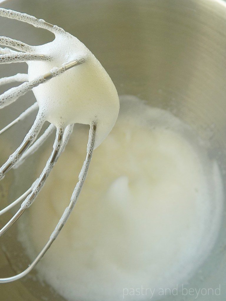 Thick foams on a whisk after mixing the egg whites at medium speed.