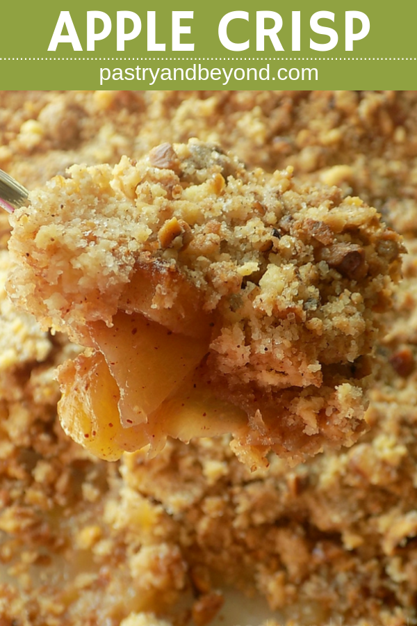Spooned apple crumble with text overlay.