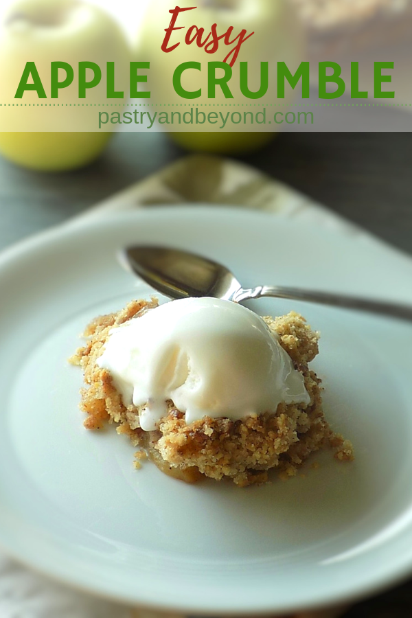 Apple crumble with ice cream on top with text overlay.
