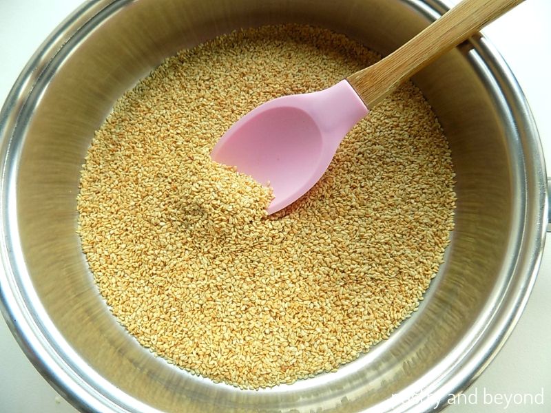 Toasting the sesame seeds in a pan. 