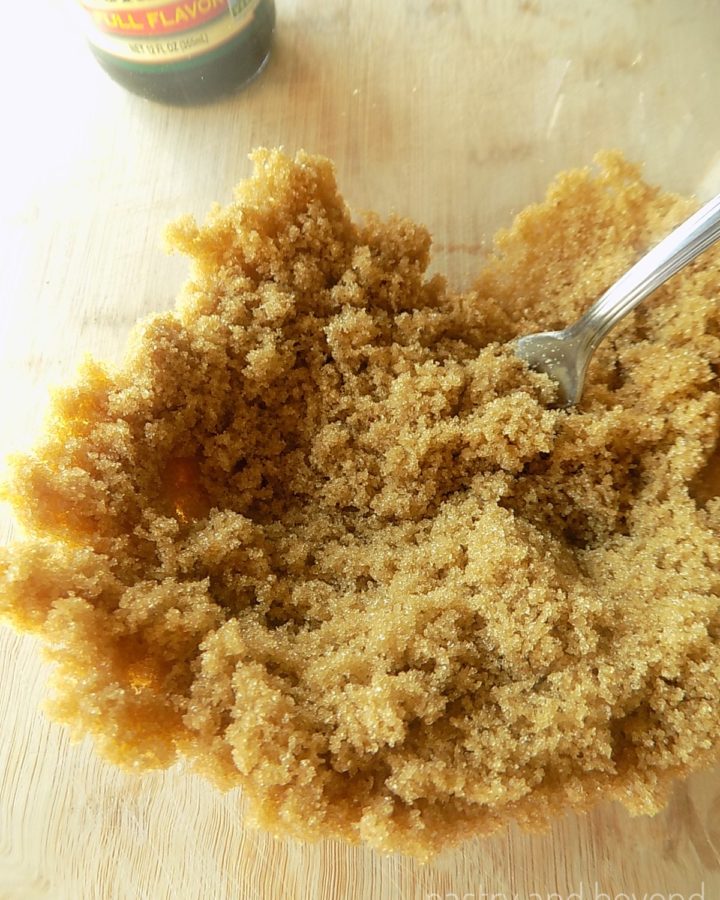 Light brown sugar in a bowl with a fork after sugar and molasses are mixed.