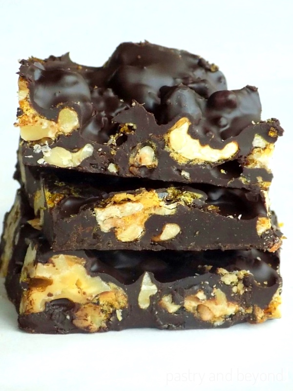 Stacked chocolate candy bark with nuts.