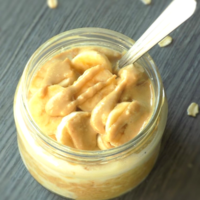 Gluten free peanut butter banana overnight oats in a jar with a spoon.
