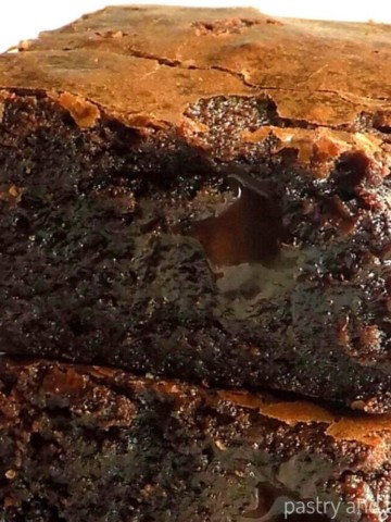 Stacked fudgy brownies without cocoa powder.