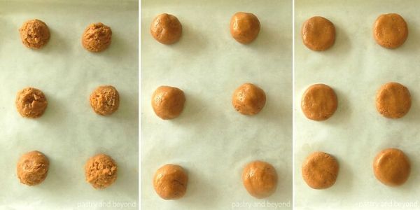 Cookie dough balls on a parchment paper and flattened.
