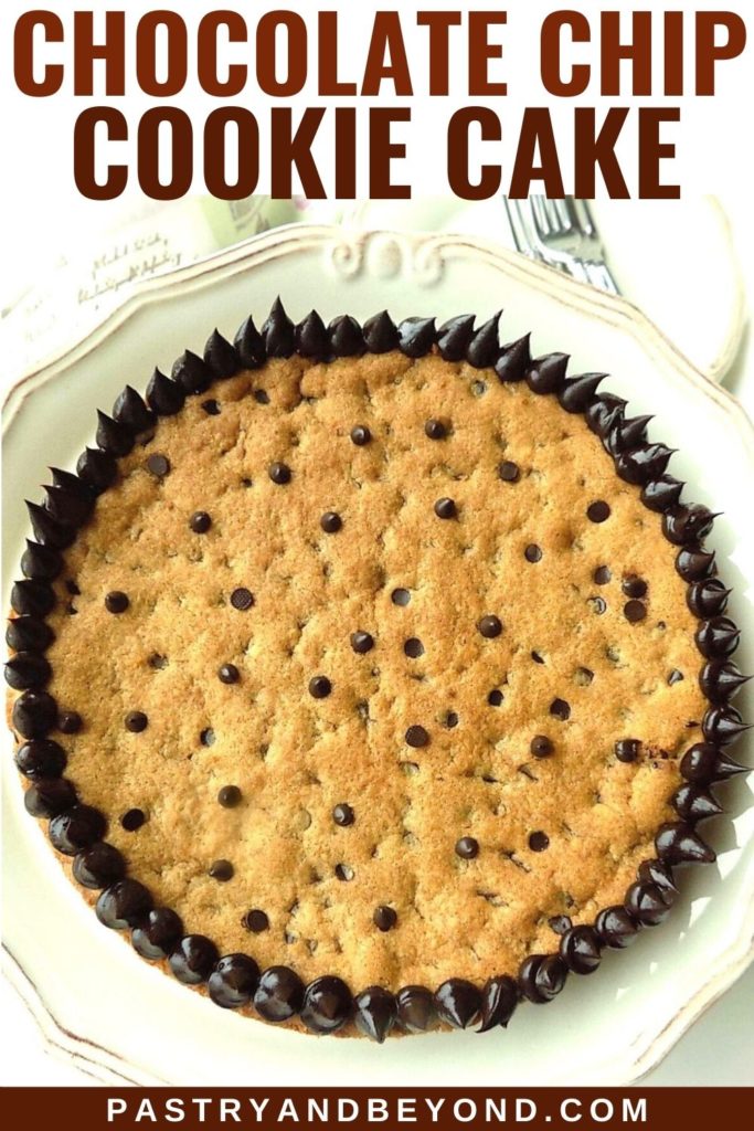 Chocolate chip cookie cake on a serving plate with text overlay.