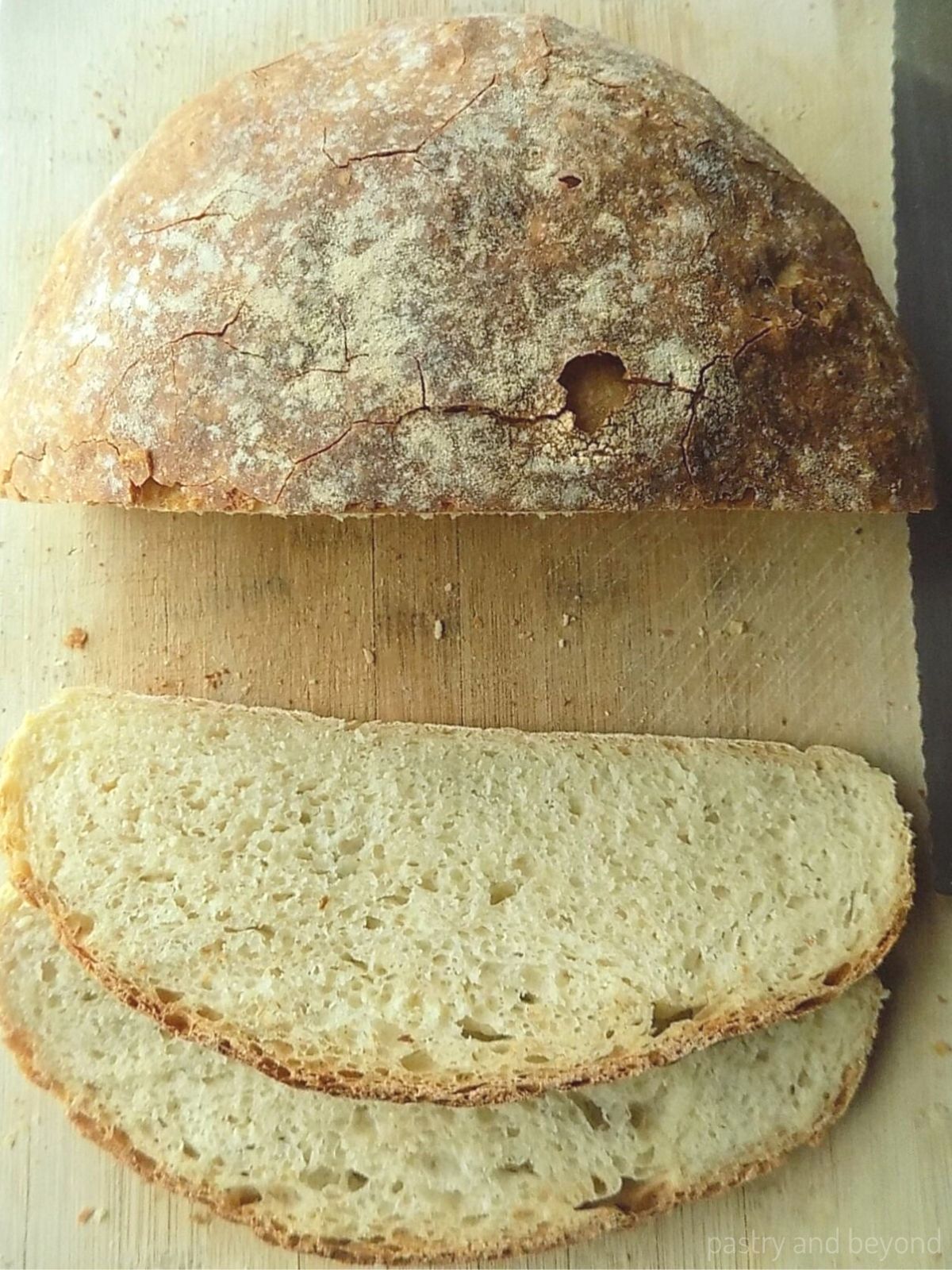 Sliced no knead round loaf bread.
