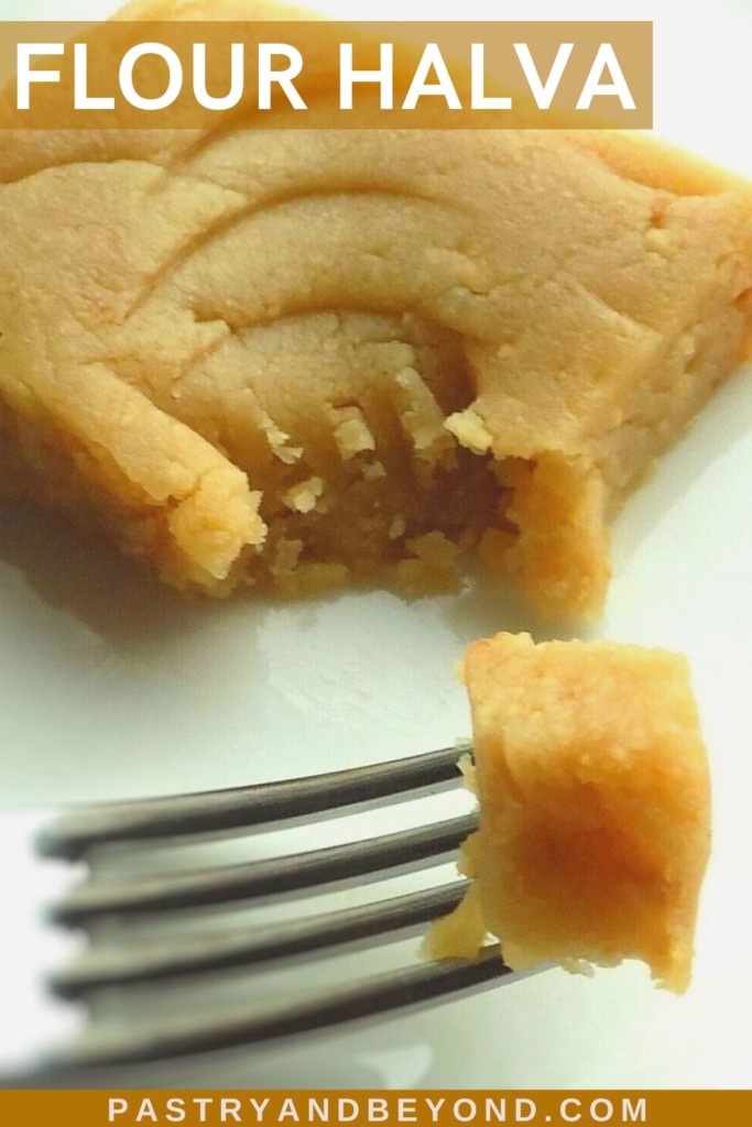 Slice of flour halva with a bite on a fork.