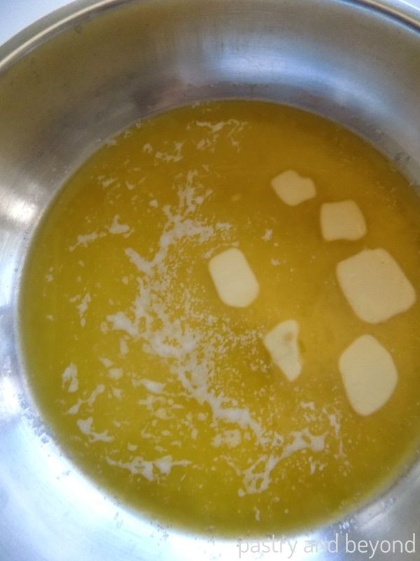 Halfway melted butter in a pan.