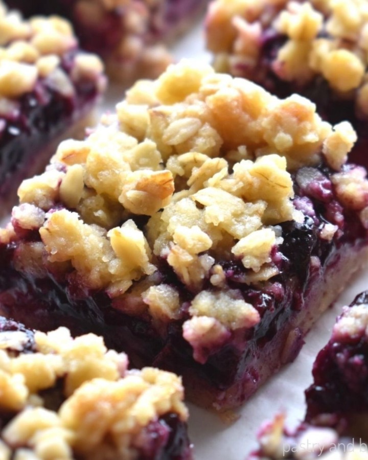 Blueberry oatmeal crumble bars on a parchment paper.