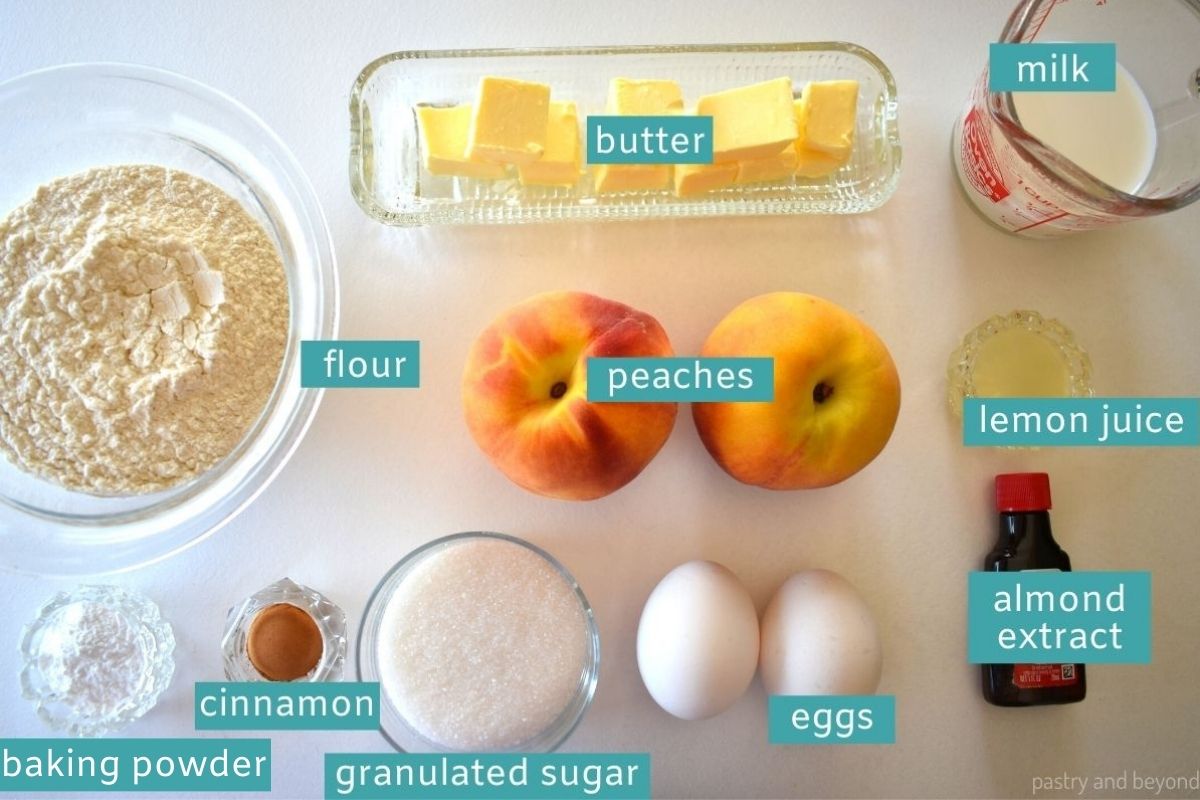Ingredients to make peach bread on a white surface.
