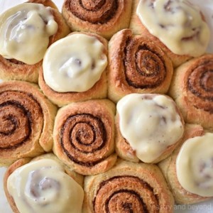 Cinnamon rolls with some of them iced on top.