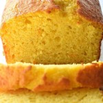 Orange cake loaf with slices.