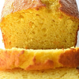 Orange cake loaf with slices.