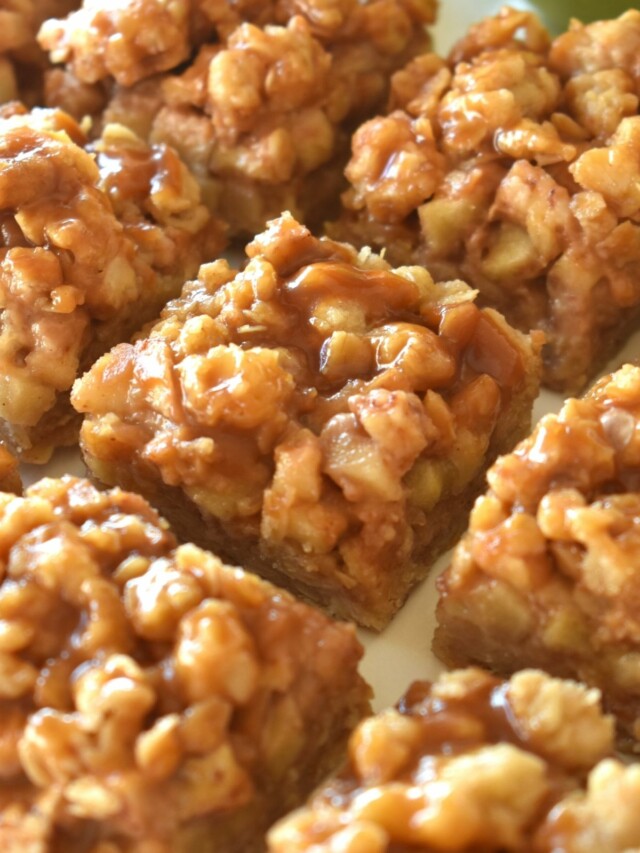 Caramel apple bars on a white surface.