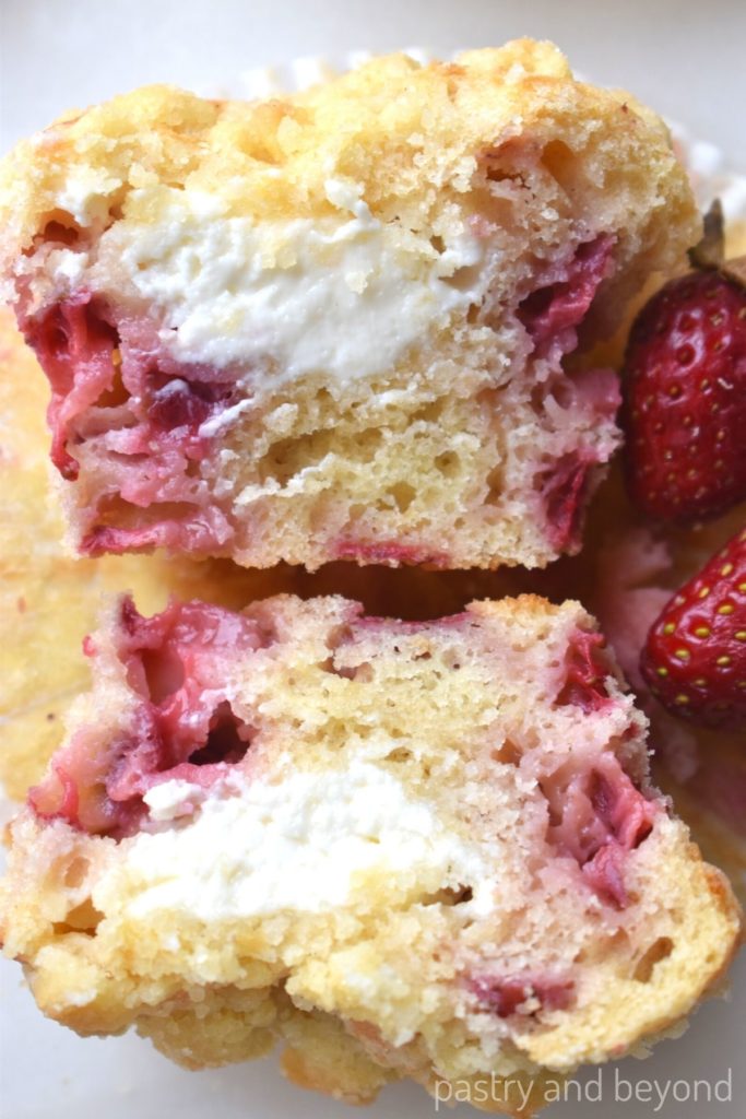 Strawberry cream cheese muffin that is divided in half.
