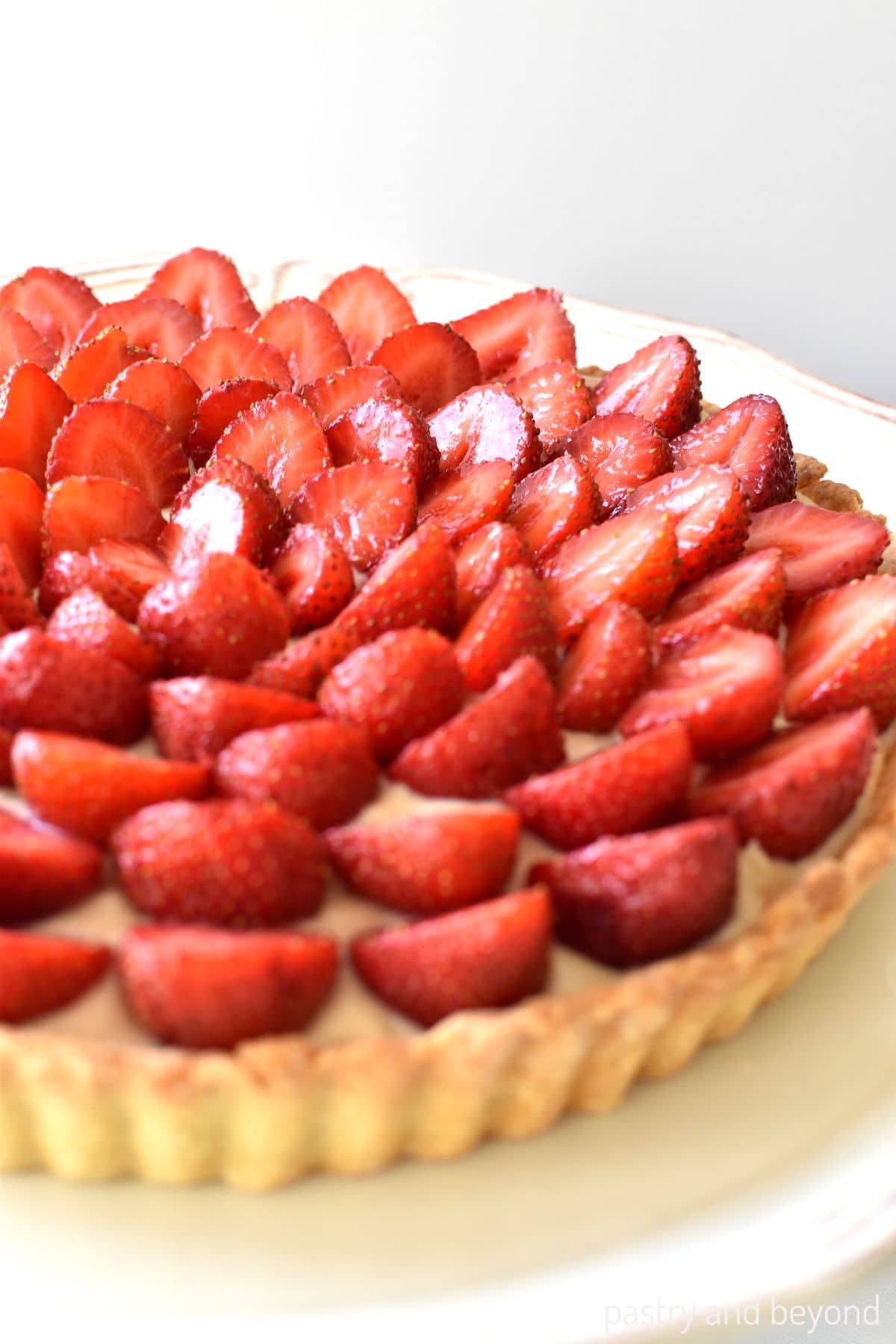 Strawberry tart on a plate.
