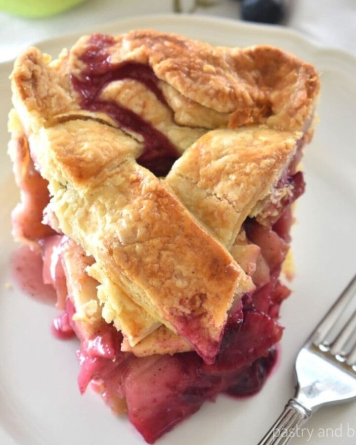 Apple blueberry pie on a plate.