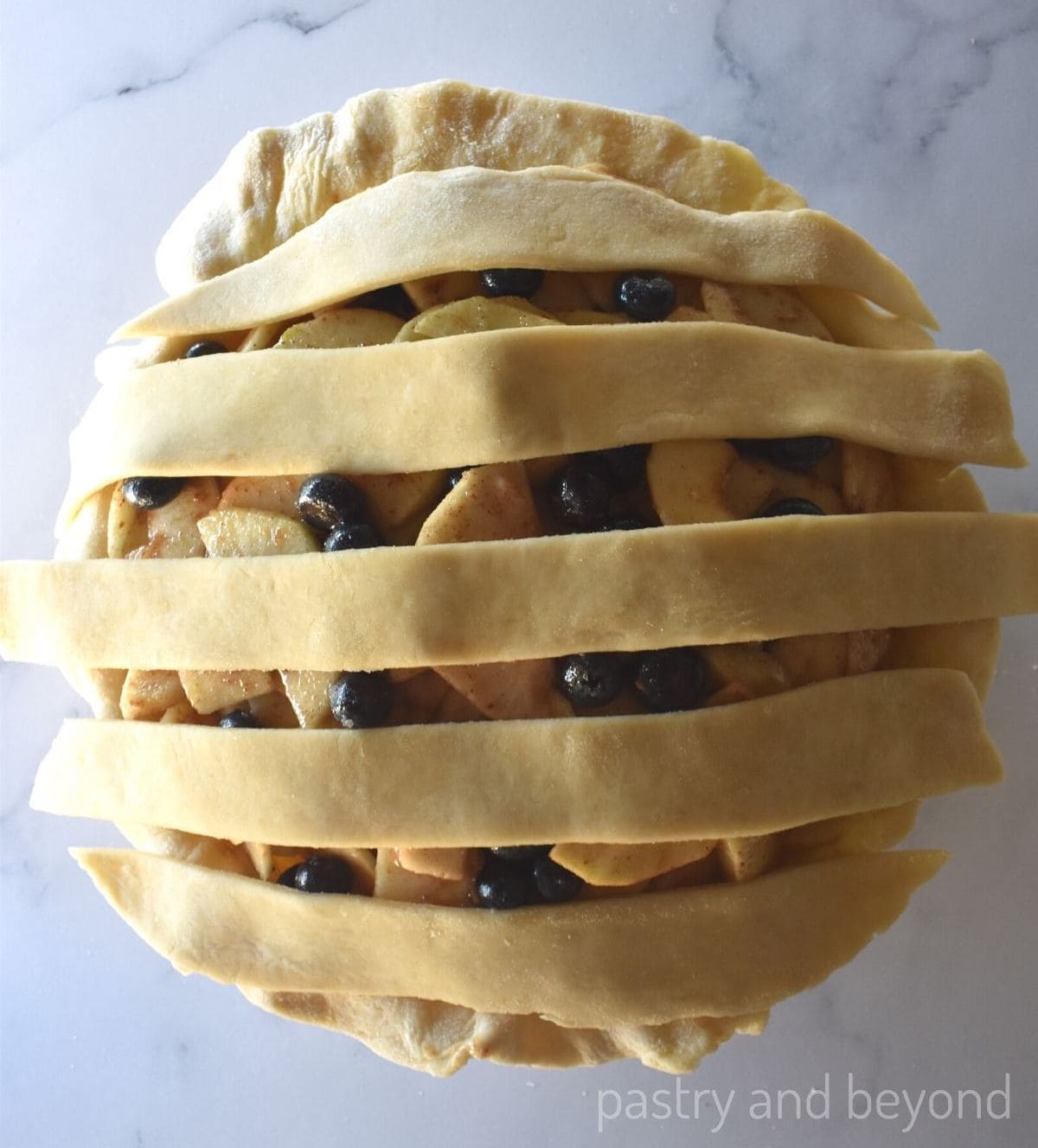 Placing five strips horizontally on top of the pie.