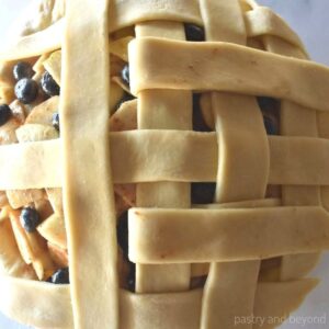 Showing how to lattice a pie crust.