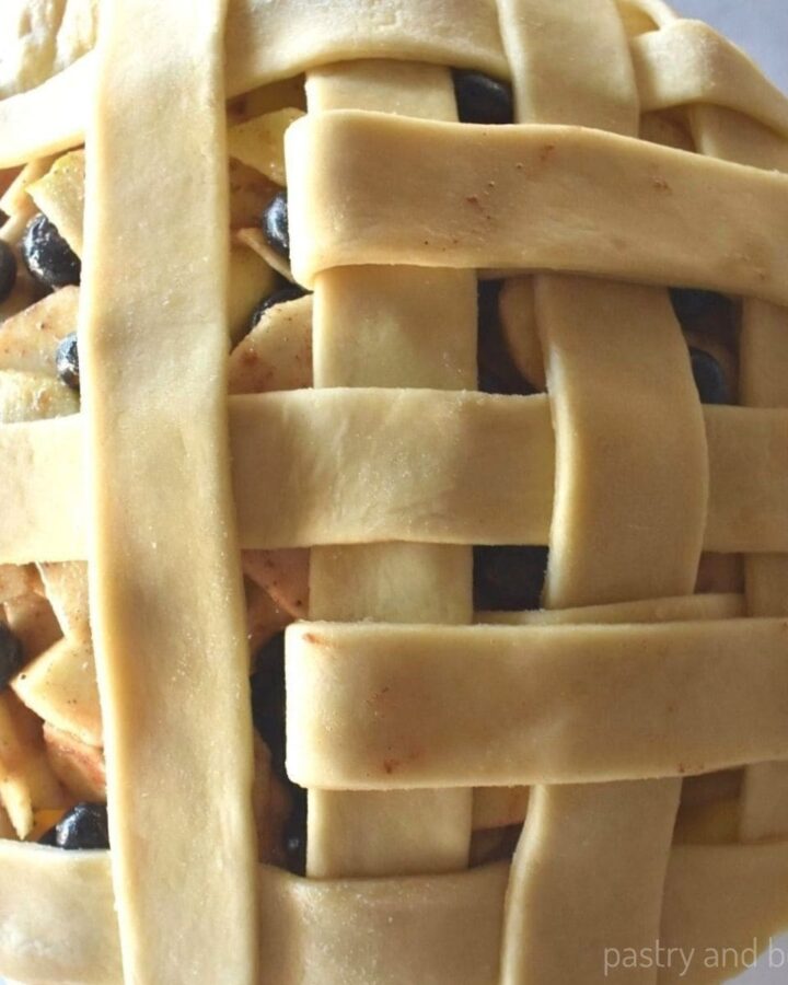 Showing how to lattice a pie crust.