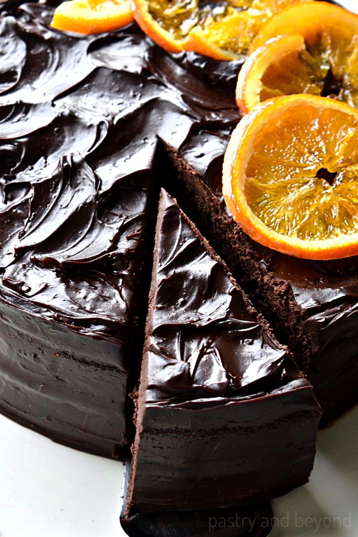 Chocolate orange cake with candied orange slices on top.