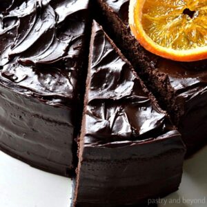 Chocolate orange cake with candied orange on top.