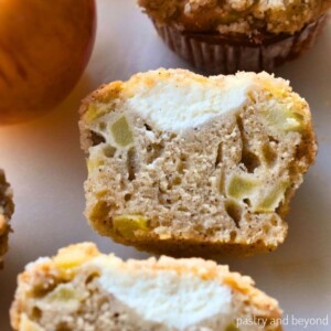 Apple cream cheese muffin that is cut in half.
