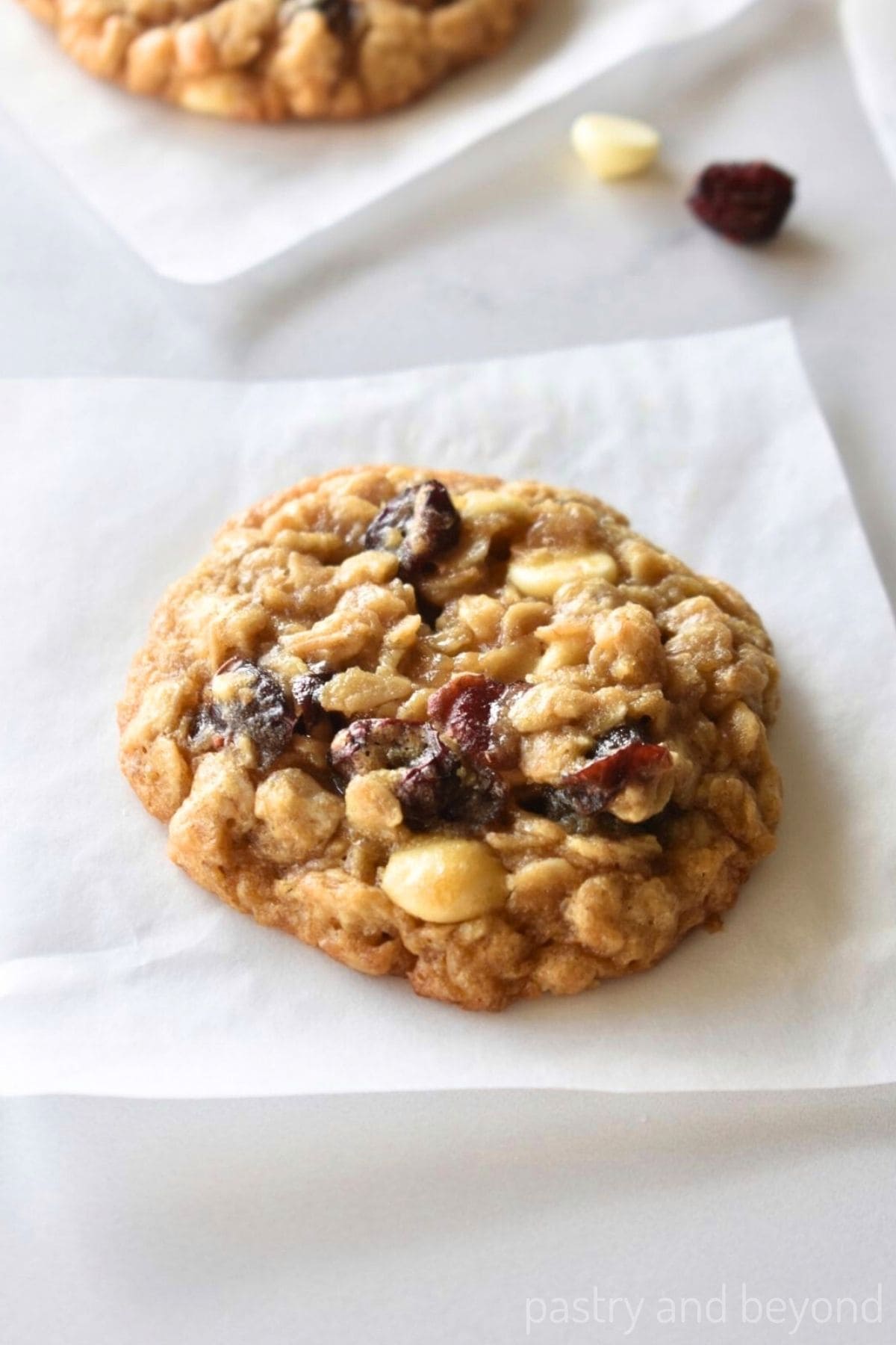 Cranberry white chocolate cookie on a parchment paper.