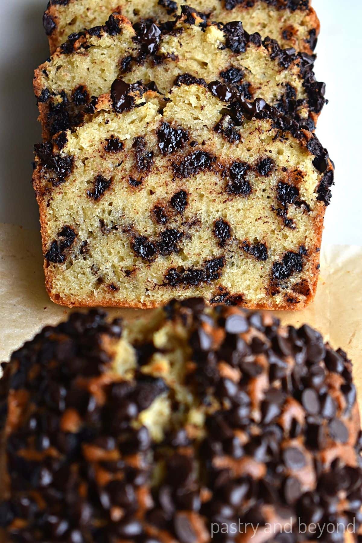 Chocolate chip loaf cake slices in a row.