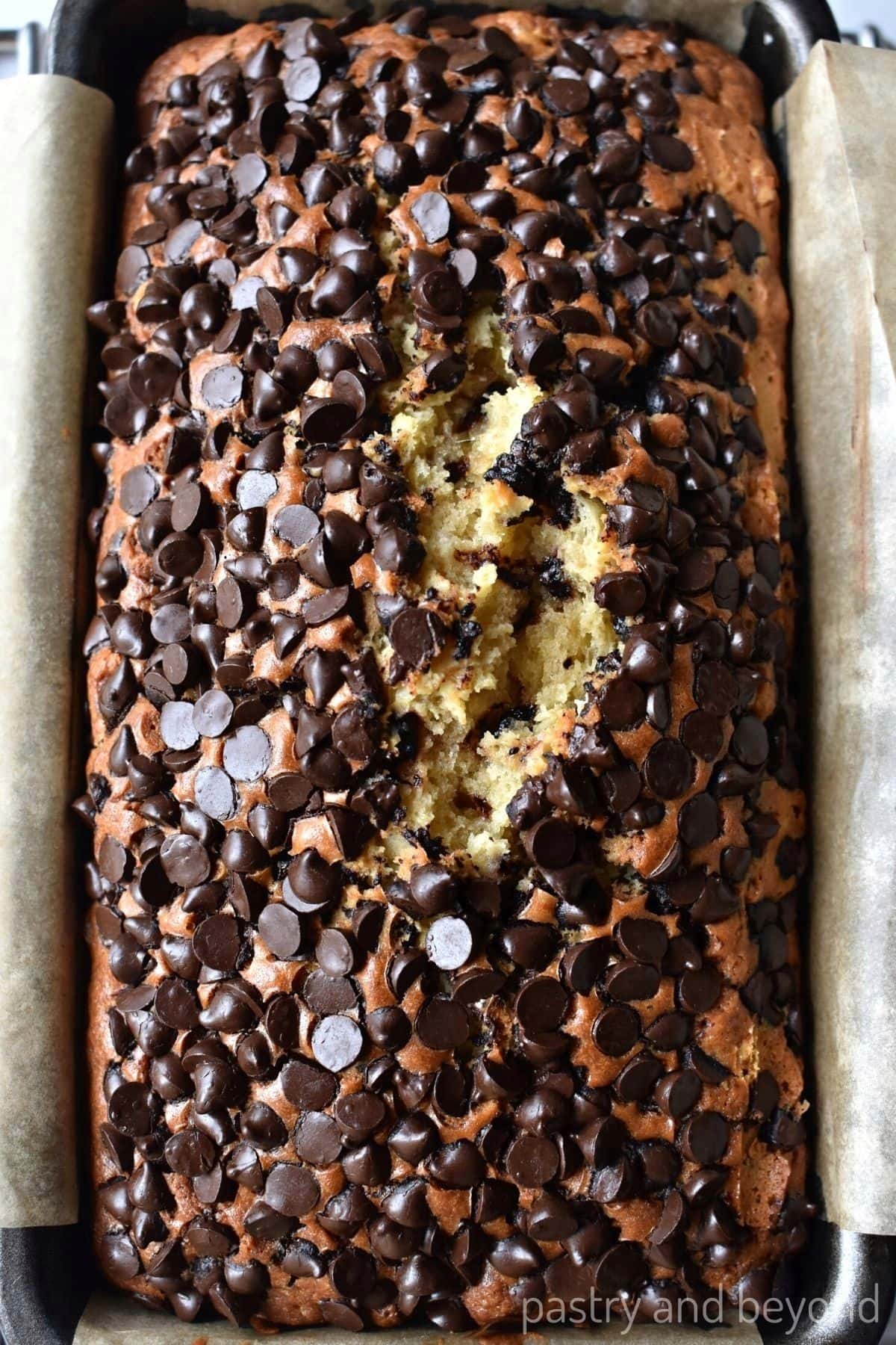 Chocolate chip loaf cake in a pan.