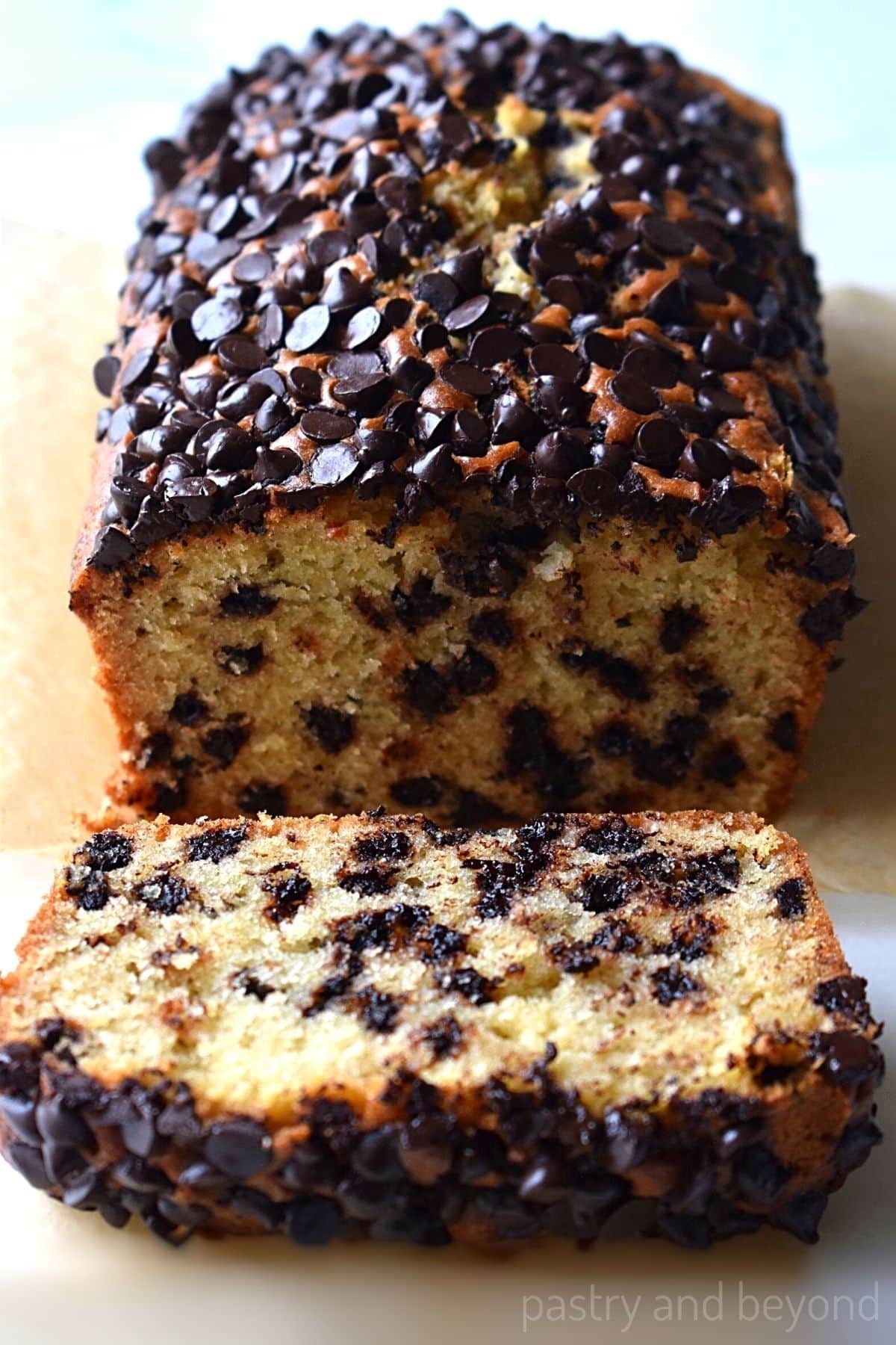 Chocolate chip loaf cake with a slice.